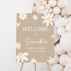 a baby shower sign surrounded by balloons