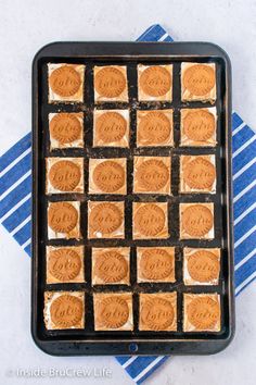 a pan filled with peanut butter cookies on top of a blue and white towel