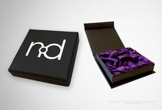 Rigid display box We used mounted black Colorplan with white foil and included a purple silk fitment for a luxurious finish with a magnetic closer. White Foil, Purple Silk, Display Boxes