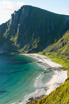 an image of a beach that looks like it is in the middle of some mountains