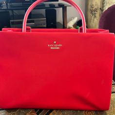 Like New Condition No Marks. Inside Is Gorgeous With Navy And White Striped Lining Pockets On The Inside And Separate Compartment And Snapshot. Also Compartment In The Back For Your Phone. New Condition!! Kate Spade Red Rectangular Shoulder Bag, Kate Spade Red Tote Shoulder Bag, Kate Spade Red Travel Bag, Kate Spade Red Bags For Daily Use, Kate Spade Red Satchel Bag, Red Kate Spade Shopping Bag, Red Kate Spade Bag For Shopping, Kate Spade Red Evening Bag, Bags Kate Spade