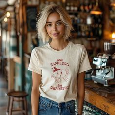 Brighten your wardrobe with our "More Espresso Less Depresso" T-shirt! This Retro Coffee TShirt features a vintage-style graphic designed for true coffee lovers. Made with soft, high-quality fabric, it offers the perfect blend of comfort and durability. Unisex and trendy, it's a great addition to any casual outfit. Ideal for coffee enthusiasts and those who appreciate a good laugh, this funny quote tee makes a thoughtful gift. Embrace the humor and style of your daily grind with this must-have shirt! UNVEILING OUR CLASSIC UNISEX JERSEY TEES: * Crafted with 100% Airlume combed and ring-spun cotton for that feather-light, breathable feel. Perfect for both hitting the gym and hitting the couch. * Each tee is printed with precision and care, ensuring every design lives up to our high standards Coffee Color Crew Neck T-shirt For Everyday, Casual Coffee-colored Screen Print T-shirt, Coffee Color Short Sleeve T-shirt With Screen Print, Casual Coffee Pre-shrunk Tops, Casual Coffee Crew Neck T-shirt, Coffee Color Crew Neck Top, Coffee-colored Graphic Tee With Funny Print, Casual Coffee Crew Neck Top, Casual Coffee-colored Crew Neck Top