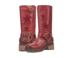 Blacklist Women's Cowboy Harness Boot in Red by Dingo. The blacklist leather boot from Dingo1969 exudes cool girl vibes, showcasing suede star inlays, rebel harness detailing, and adjustable double straps that effortlessly captures attention. Embody a biker chic aesthetic featuring a plain toe and 2- inch urban stack heel. Leather upper Rubber outsole Round toe Pull-on style 2" heel height 12" shaft height Solid red with star inlay Harness accent with buckle details Imported Burnished accent on Urban Block, Star Boots, Chic Aesthetic, Biker Chic, Shoes Boots Ankle, Harness Boots, Denim Skirt Women, Cowboy Boots Women, Leather Boots Women