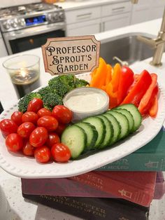 a white plate topped with cucumbers, tomatoes and broccoli next to a sign that says professor sprout's garden