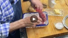 a man is preparing food on a cutting board