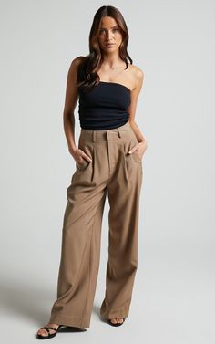 Elevate your everyday style with our Augustus Pant in Latte! These high-waisted wide leg tailored pants are a versatile addition to your wardrobe. Made from soft and breathable rayon, they are perfect for all-day comfort. The neutral latte color adds a touch of sophistication to any outfit. Whether you're dressing up for the office or keeping it casual on the weekends, these full-length pants will effortlessly take you from day to night. Embrace your unique sense of style and feel empowered in o Chic Rayon Wide-leg Pants, Elegant Wide Leg Rayon Pants, Rayon Wide-leg Workwear Pants, Versatile Solid Color Wide-leg Culottes, Chic High-waisted Wide Leg Rayon Pants, Versatile High-waisted Viscose Pants, High-waisted Viscose Wide Leg Pants For Work, Chic Rayon Ankle Pants, High Waist Solid Rayon Bottoms