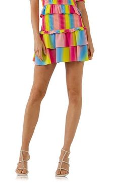 Rows of rainbow-inspired stripes playfully animate this smocked-waist miniskirt finished with flouncy ruffled tiers. Smocked waist Lined 100% polyester Hand wash, dry flat Imported Pink Tiered Bottoms With Layered Hem, Tiered Pink Mini Skirt With Ruffles, Tiered Ruffled Mini Skirt In Pink, Summer Ruffled Mini Bottoms, Multicolor Mini Bottoms For Summer, Mini Ruffle Bottoms For Summer, Multicolor Mini Length Summer Bottoms, Playful Multicolor Ruffled Skirt, Flowy Multicolor Lined Skort