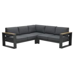 an outdoor sectional sofa with two side tables