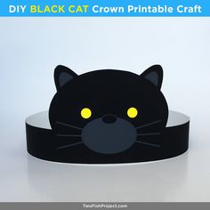 a black cat headband with yellow eyes on white background and text that reads diy black cat crown printable craft