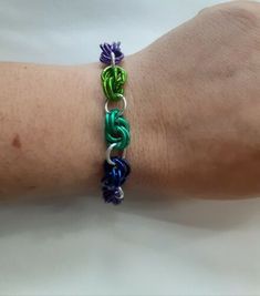 a person's arm with a bracelet on it