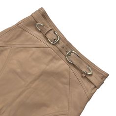 Camila Coelho Luci Leather Mini Skirt Size SmallColor NudePreloved No damages Approx. Measurements Length 14.5" - 18"Waist 14"Hips 17"Website DetailsSelf: 100% leather.Lining: 95% poly, 5% elastic. Made in India. Professional leather clean only. Fully lined. Exposed back zipper closure. Detachable waist belt with dual buckle closure. Hi-low hem. Waist to shortest hem measures approx 15" and to longest hem approx 17.5" in length. Revolve Style No. COEL-WQ95. Manufacturer Style No. CCQ116 F21.1233 Fitted Belted Beige Mini Skirt, Fitted Beige Belted Mini Skirt, Fitted Skirt With Belt Detail, Belted Beige Mini Skirt Bottoms, Beige Mini Skirt With Belt Loops, Chic Beige Skirt With Belt Loops, Leather Cleaning, Leather Mini Skirts, Waist Belt