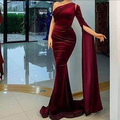 Heres a Stunning maxi mermaid Velvet dress made with love in Nigeria. This dress will make You stand out in that event You'll be rocking it to. This can be created in any colour You desire. This piece is a long body-fitted dress you can rock confidently and You'll never go unnoticed on this stunt.  Perfect for weddings, vow renewal, homecoming, birthdays, engagement and formal events  Custom measurements are welcomed (preferred) but its absolutely fine if you don't have your measurements, Our size chart is pretty accurate. Kindly include your height to enable Us use a suitable length for your dress  CARE INSTRUCTIONS: *Wash with mild soap. *Do not machine wash. *Do not bleach. Kindly start up an Etsy conversation if you have any question Thank you for visiting.