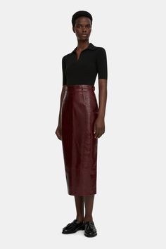 The Lorelei pencil skirt follows the Emilia Wickstead feminine tailoring, constructed from a supple leather in an oxblood tone. The Lorelei pencil skirt it cut to a high waist and is finished with a vent at the back. this skirt exudes sophistication and grace, offering both style and comfort for any occasion. Fitted Leather Pencil Skirt In Modern Style, Fitted Modern Leather Pencil Skirt, Modern Fitted Leather Pencil Skirt, Formal Fitted Leather Pencil Skirt, Chic Leather Pencil Skirt For Formal Occasions, Fall Formal Leather Pencil Skirt, Elegant Leather Pencil Skirt For Work, Classic Leather Pencil Skirt For Office, Chic Leather Pencil Skirt For Work