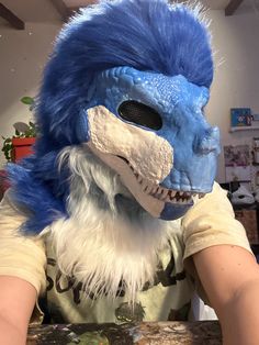 a person wearing a blue and white monster mask