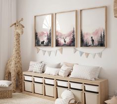 a room filled with lots of furniture and pictures on the wall next to a stuffed giraffe