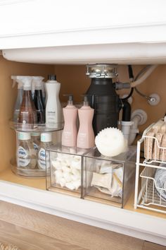 the shelves are organized with soaps, shampoos and other items