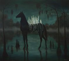 a horse is standing in the water with candles on its back