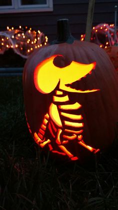 a pumpkin carved to look like a skeleton