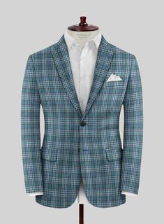 Upgrade your sophisticated attire with our Noble Rosalinda Check Cotton Silk Linen Jacket, adding a confident touch to your entire ensemble. Expertly crafted from a luxurious blend of cotton and silk in a unique check pattern featuring shades of blue, green, and off-white. Elevate your traditional plaid jacket with a modern twist and embrace a comfortable fit that will enhance your every moment. Enhance your impeccable taste in fashion with our exquisite jacket and exude charm with style.   Abou