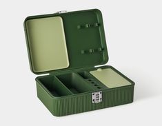 an open green box with compartments on the inside