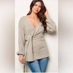 * 50% Viscose 22% Nylon 28% Pbt. * Hand Wash. * Model Is Wearing Size S Length: 26" Bust: 32" Waist: 16". Taupe Tops For Fall Day Out, Taupe Tops For Day Out In Fall, Taupe Tops For A Fall Day Out, Fall Taupe V-neck Top, Chic Taupe Tops For Fall, Chic Taupe Winter Tops, Womens Lace Tops, Tie Wrap, Gray Top