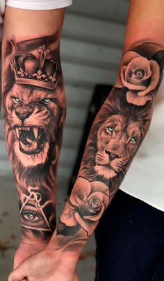 two people holding hands with tattoos on their arms and one has a lion, rose and crown