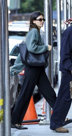 a man and woman walking down the street