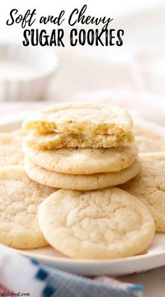 soft and chewy sugar cookies are stacked on a white plate with the title above it