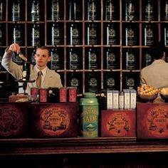 two men behind a counter in a liquor store