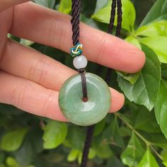 This exquisite donut pendant is handmade from Myanmar Grade A (untreated) jadeite, and the length of the lanyard can be adjusted. The jade color of this pendant is fresh, natural and full of green, as if it takes you into the jade forest, which is refreshing and refreshing. At the same time, it also cleverly incorporates a little honey yellow, adding a touch of warm color to the whole work, as if to tell you that there is not only the hope of green in life, but also the warmth of honey yellow. J Luck Necklace, Donut Pendant, Good Luck Necklace, Jade Color, Honey Yellow, Comme Si, Jade Necklace, The Hope, Green Jade