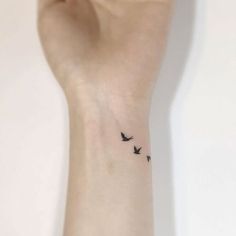 small birds tattoo on the wrist