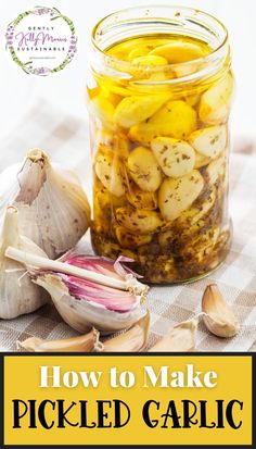 garlic and lemon pickles in a jar on a towel next to an onion bulb