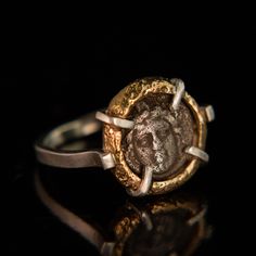 This Relic style ring features an ancient coin circa 250-190 BC. The coin is from the Pisidia region which is located in modern-day southern Turkey. This coin depicts the helmeted head of Athena, the goddess of wisdom, war and the crafts. For the warrior in you or in your life, this ring is a powerful talisman. Our Relic styles are handcrafted using traditional sandcasting techniques. The bezel surrounding this coin was formed from wax that was used to create a mold in sand. Molten gold was pour Southern Turkey, Molten Gold, Goddess Of Wisdom, Ancient Coin, The Crafts, The Warrior, Coin Ring, Ancient Coins, Bespoke Jewellery