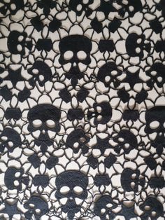 black and white lace with skulls on it