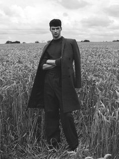 a man standing in the middle of a field