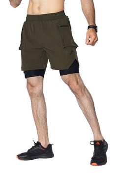 EGNAR Cargo Short in a high-performance short. The silhouette is distinguished by two zippered cargo pockets on the shell. The shorts feature a built-in liner with two media pockets for bounce-free storage, mesh panels for ventilation, anti-odor technology. The backside features a utility loop for a shirt or towel while training. The drawstrings tips are heat-dipped and the side splits are reinforced with tack seams to increase overall durability. Features Slim fit Egnar logo Woven, compression-lined short 5.5" Inseam Side Zip pockets Sports Athletic Shorts With Cargo Pockets, Athletic Sports Shorts With Cargo Pockets, Green Cargo Sports Shorts, Functional Athletic Shorts With Cargo Pockets, Athletic Cargo Shorts For Sports, Athletic Shorts With Cargo Pockets For Sports, Techwear Sports Shorts With Built-in Shorts, Outdoor Compression Athletic Shorts With Built-in Shorts, Storage Mesh