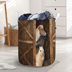 two horses are standing in the open door of a storage bin that is filled with clothes