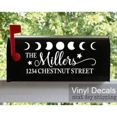 a black mailbox with the words, the millers 1234 chestnut street painted on it