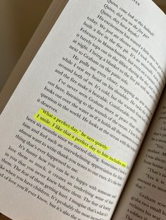 an open book with a yellow highlight on the bottom page and some words below it