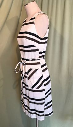 "This is a cute vintage dress from the 60's. No labels or tags. No size tag. The bust measures 36\", waist 34\", see measurements below. Made of a black, brown & white nylon fabric in a horizontal stripe. The dress is not lined. It is sleeveless with a rounded neckline. It has large patch pockets on the front hips. There are fabric belt loops at the waist & a matching belt with metal tips. Zips in the back with a metal zipper. The dress is in very good condition, no wear or tear. No soil Belted Shift Dress, Pleated Bodice, Horizontal Stripes, Fabric Belt, Gathered Skirt, Cute Sets, Pleated Dress, Skirt Outfits, Shift Dress