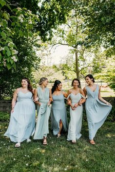 the bridesmaids are all dressed in light blue dresses