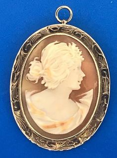 * Victorian 10K Yellow Gold Oval Carved Cameo Floral Scroll Brooch Pendant * Length: 2" including the bale * Width: 1-3/8" * Oval cameo measures: approximately 1-3/8" x 1-1/8"  * Weight: 10.0 tgw * Marked: 10K * Chain is not included, but can be purchased for an additional price. * Condition: Great * G737    Exported By ExportYourStore :) Luxury Ornate Oval Pendant Necklace, Cameo Necklace, Etsy Accessories, Jewelry Necklaces, Accessory Gift, Gift Card, Yellow Gold, Carving, Necklaces