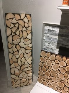 two pieces of wood stacked on top of each other in front of a fire place