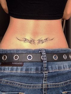 a woman with a tattoo on her stomach