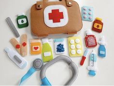 an assortment of medical items laid out on a white surface, including a doctor's stethoscope