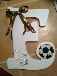 the number five is decorated with a soccer ball