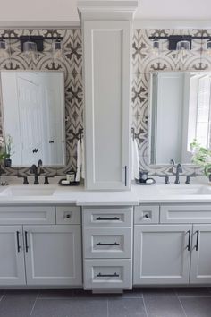 a bathroom with two sinks and mirrors on the wall next to each other in it