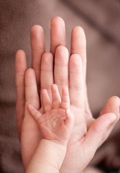 a black and white photo of a person's hand