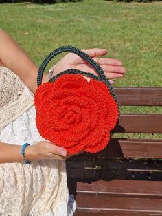 Handmade crochet purse like rose.  This handbag is a stylish and elegant accessory that easily matches almost every outfit. It can be used as an evening handbag. Unique design, giving it an exclusive look. You are sure to catch the attention of others with your original style. The bag opens at the top. It is made of durable polyester cord. One side is orange color other side is dark green. Handbag is comfortable, you can put in bag phone and other things for women. It will be great gift for moth Handmade Crochet Clutch Bag For Gift, Crochet Shoulder Bag For Gift, Elegant Hand Knitted Crochet Bag For Gift, Elegant Hand-knitted Crochet Bag For Gift, Orange Top Handle Shoulder Bag Gift, Handmade Crochet Tote Bag For Party, Handmade Crochet Handheld Bag For Parties, Handheld Crochet Shoulder Bag As Gift, Handmade Orange Evening Bag