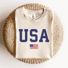 a white t - shirt with the word usa printed on it